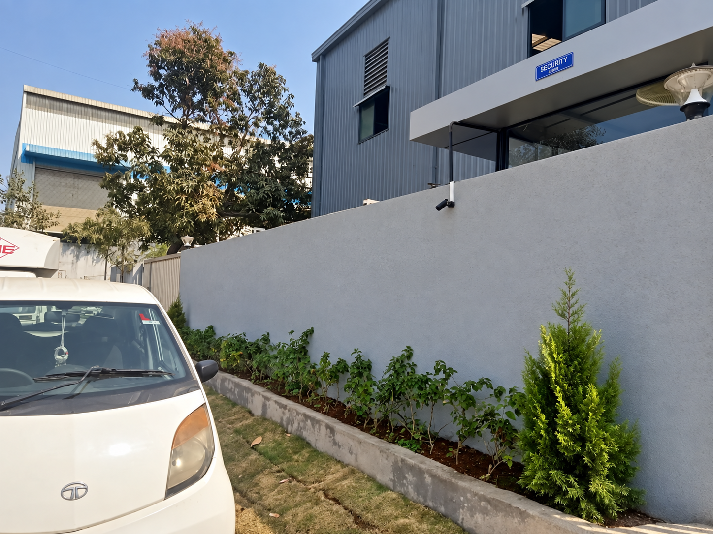 Factory entrance and landscaped surroundings at Kapoor Global Enterprises